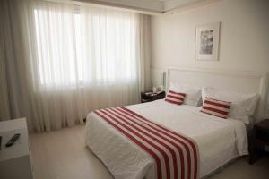 Cama ou camas em um quarto em Plaza São Rafael Hotel