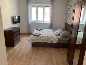 Voodi või voodid majutusasutuse Apartmány TIME toas