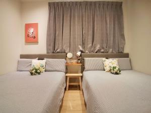 Una cama o camas en una habitación de 高雄好日子914包棟KTv民宿