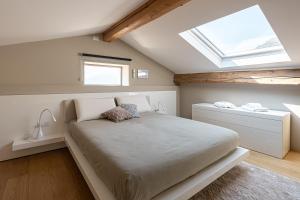 En eller flere senge i et værelse på MiròItaly Apartments
