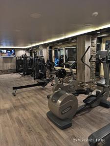 a gym with several treadmills and cardio machines at Dolphin Ras El-Bar Hotel in Ras El Bar