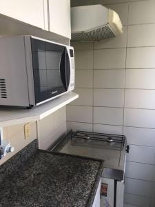 Η κουζίνα ή μικρή κουζίνα στο Flat Golden Plaza - Lourdes +4 φωτογραφίες