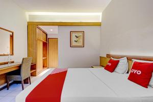 Tempat tidur dalam kamar di Super OYO Flagship 90658 Hotel Asteria