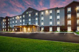 a rendering of a hotel with a parking lot at WoodSpring Suites Elgin - Chicago in Elgin