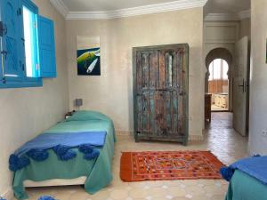 Llit o llits en una habitació de Taghazout Ocean View