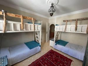 Llit o llits en una habitació de Taghazout Ocean View