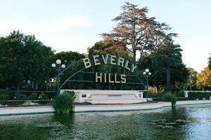 a sign that reads everyday kills in a pond at Montrose at Beverly Hills in Los Angeles +41 photos