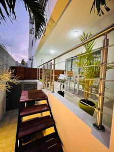 a balcony with stairs and plants on a building at Beachcove Apartment 2 in Pereybere
