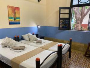 Voodi või voodid majutusasutuse Hostal La Ermita toas
