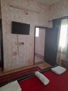 TV a/nebo společenská místnost v ubytování Magtas Hotel