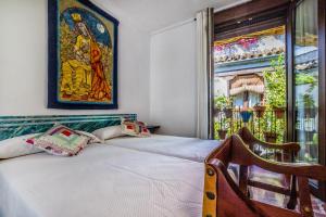 Postel nebo postele na pokoji v ubytování Apartamento con patio cordobés en San Basilio & Parking