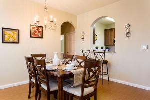 a dining room with a table and chairs at 3Br 2Bath Condo Balcony 5min Conv Center 1410ft in Orlando
