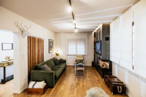 A television and/or entertainment centre at Fort D-Val luxurious apartment