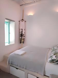 A bed or beds in a room at Serifos Sugar Cubes