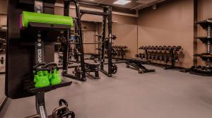 a gym with a bunch of equipment in a room at Radisson Blu Marina Palace Hotel, Turku in Turku
