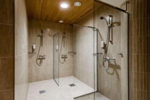 a bathroom with a shower stall and a sink at Radisson Blu Marina Palace Hotel, Turku in Turku