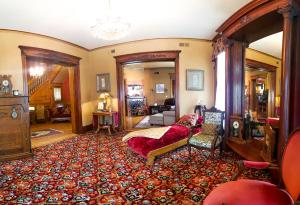 a large living room with a bed and a couch at Linda Sue Manor in Sioux City