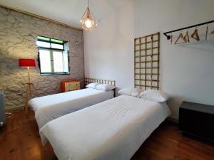 A bed or beds in a room at Ca Borines