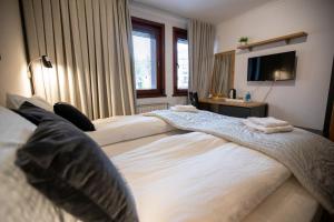 Postel nebo postele na pokoji v ubytování Apartments Kanevce Beach&Relax