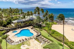 an overhead view of a swimming pool next to a beach at Polo Beach 703 - Romvari Realty in Wailea