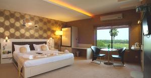 Postel nebo postele na pokoji v ubytování Regency Tuticorin by GRT Hotels