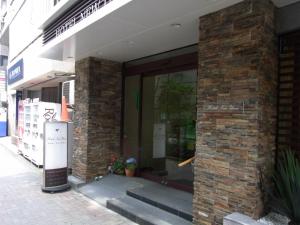 a store front of a brick building at Hotel New Ueno in Tokyo
