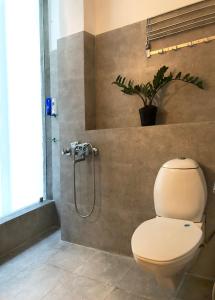 a bathroom with a toilet and a shower at House 44 2BHK in Greater Noida