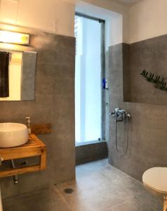 a bathroom with a shower and a sink at House 44 2BHK in Greater Noida