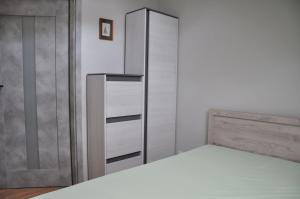 Postel nebo postele na pokoji v ubytování Willa Słoneczna