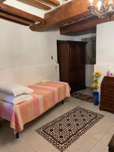 A bed or beds in a room at Affittacamere Mirella