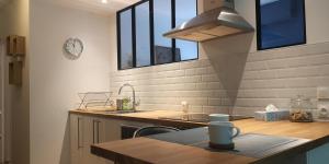 a kitchen with a sink and a counter top at Moderne et paisible studio avec balcon in Saint-Avold
