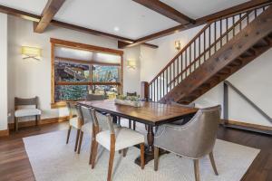 a dining room with a wooden table and chairs at LR902 The Chalet at Lewis Ranch Home in Copper Mountain