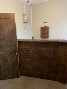 a wooden counter in a room with a door at Hotel Grant in Kharkiv