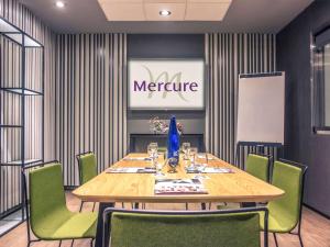 
a dining room table with a blue and white table cloth at Mercure Madrid Centro in Madrid
