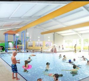 a group of children playing in a swimming pool at Cosy caravan in Hull