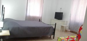TV a/nebo společenská místnost v ubytování Room&Relax