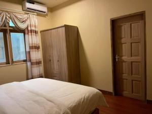 Postel nebo postele na pokoji v ubytování Endhaa, Divers Home