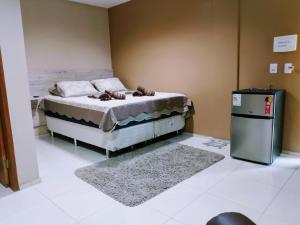 Pousada Café Com Leitte客房内的一张或多张床位