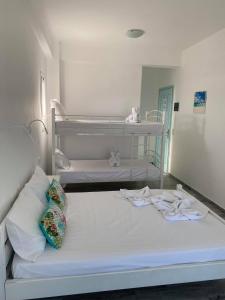 A bed or beds in a room at Cactus Beach Paros