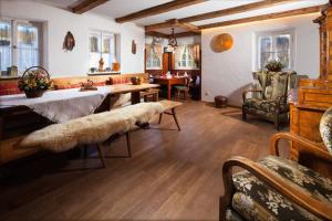 a large living room with a table and chairs at Beautiful cosy House near Königsee in Schönau am Königssee