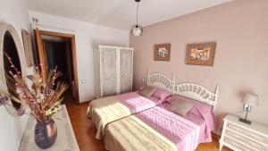 Postel nebo postele na pokoji v ubytování Apartament Vent de Port