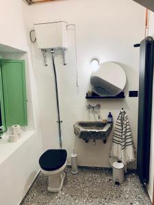 a bathroom with a toilet and a sink at Samson and the Lilo in Vipava