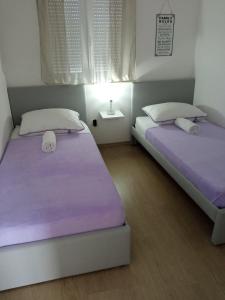 Postel nebo postele na pokoji v ubytování Holiday home Villa Anny