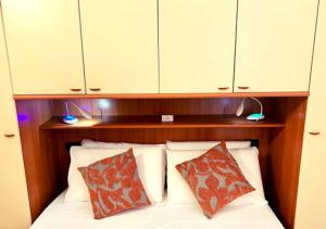 Katil atau katil-katil dalam bilik di Gardalakeapartment a Sirmione