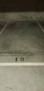 a number on the floor of a parking lot at Appartement chic avec parking gratuit à Paris in Gentilly