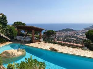 a villa with a pool and a view at Villa Panorama 360 in Lloret de Mar