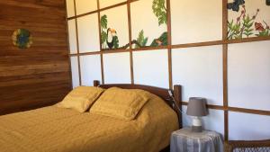 a bedroom with a bed in a room at Bella Vista Ranch Ecolodge in Turrialba