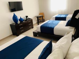 Katil atau katil-katil dalam bilik di Hotel Galerias HN