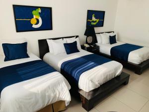 Katil atau katil-katil dalam bilik di Hotel Galerias HN