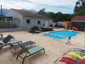 a patio with chairs and a swimming pool at La Céret'nitude in Céret